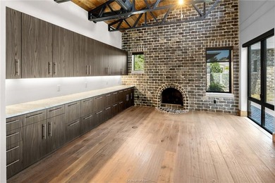 Experience luxury redefined in this private 6,021 SqFt custom on The Traditions Club At Texas A and M in Texas - for sale on GolfHomes.com, golf home, golf lot