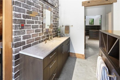 Experience luxury redefined in this private 6,021 SqFt custom on The Traditions Club At Texas A and M in Texas - for sale on GolfHomes.com, golf home, golf lot