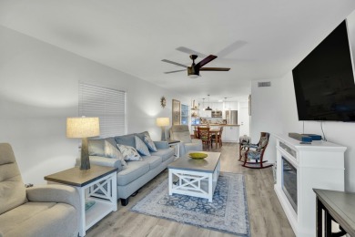 Remarkably renovated 1st floor corner unit located in Vista on Vero Beach South Golf Course in Florida - for sale on GolfHomes.com, golf home, golf lot