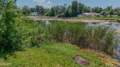 WATERFRONT! Large lot located in the highly desired 'Lynn Haven' on Panama Country Club in Florida - for sale on GolfHomes.com, golf home, golf lot