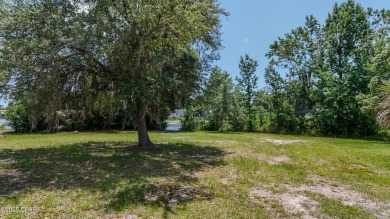 WATERFRONT! Large lot located in the highly desired 'Lynn Haven' on Panama Country Club in Florida - for sale on GolfHomes.com, golf home, golf lot