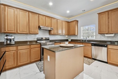 This 4 bedroom and 2.5 bath home has a great pond view, and is on Heritage Isles Golf and Country Club in Florida - for sale on GolfHomes.com, golf home, golf lot