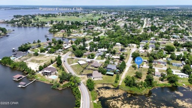 WATERFRONT! Large lot located in the highly desired 'Lynn Haven' on Panama Country Club in Florida - for sale on GolfHomes.com, golf home, golf lot