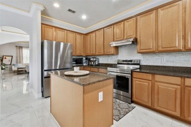 This 4 bedroom and 2.5 bath home has a great pond view, and is on Heritage Isles Golf and Country Club in Florida - for sale on GolfHomes.com, golf home, golf lot