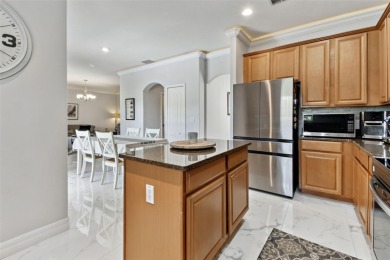 This 4 bedroom and 2.5 bath home has a great pond view, and is on Heritage Isles Golf and Country Club in Florida - for sale on GolfHomes.com, golf home, golf lot