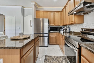 This 4 bedroom and 2.5 bath home has a great pond view, and is on Heritage Isles Golf and Country Club in Florida - for sale on GolfHomes.com, golf home, golf lot