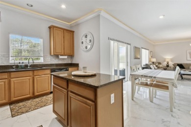 This 4 bedroom and 2.5 bath home has a great pond view, and is on Heritage Isles Golf and Country Club in Florida - for sale on GolfHomes.com, golf home, golf lot