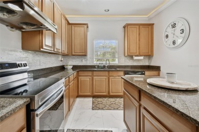 This 4 bedroom and 2.5 bath home has a great pond view, and is on Heritage Isles Golf and Country Club in Florida - for sale on GolfHomes.com, golf home, golf lot