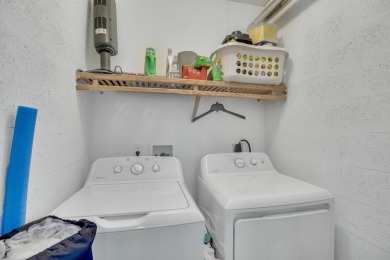 Remarkably renovated 1st floor corner unit located in Vista on Vero Beach South Golf Course in Florida - for sale on GolfHomes.com, golf home, golf lot