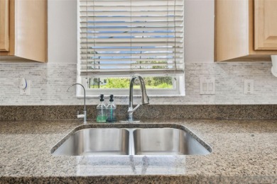 This 4 bedroom and 2.5 bath home has a great pond view, and is on Heritage Isles Golf and Country Club in Florida - for sale on GolfHomes.com, golf home, golf lot