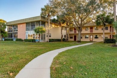 Remarkably renovated 1st floor corner unit located in Vista on Vero Beach South Golf Course in Florida - for sale on GolfHomes.com, golf home, golf lot