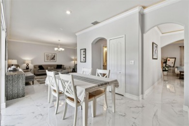 This 4 bedroom and 2.5 bath home has a great pond view, and is on Heritage Isles Golf and Country Club in Florida - for sale on GolfHomes.com, golf home, golf lot