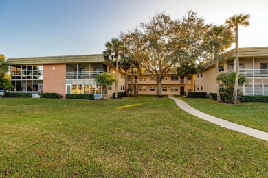 Remarkably renovated 1st floor corner unit located in Vista on Vero Beach South Golf Course in Florida - for sale on GolfHomes.com, golf home, golf lot