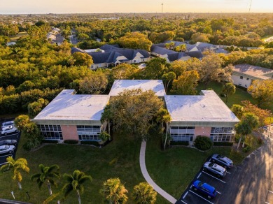 Remarkably renovated 1st floor corner unit located in Vista on Vero Beach South Golf Course in Florida - for sale on GolfHomes.com, golf home, golf lot