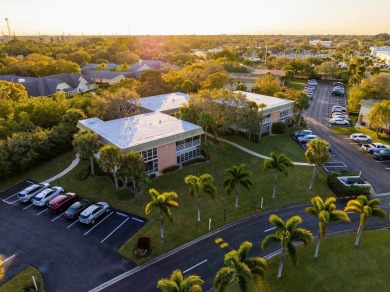 Remarkably renovated 1st floor corner unit located in Vista on Vero Beach South Golf Course in Florida - for sale on GolfHomes.com, golf home, golf lot