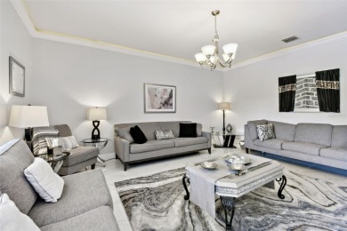 This 4 bedroom and 2.5 bath home has a great pond view, and is on Heritage Isles Golf and Country Club in Florida - for sale on GolfHomes.com, golf home, golf lot