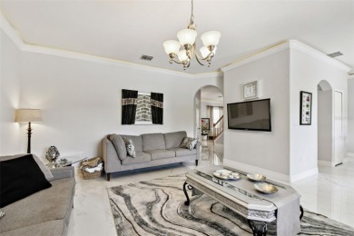 This 4 bedroom and 2.5 bath home has a great pond view, and is on Heritage Isles Golf and Country Club in Florida - for sale on GolfHomes.com, golf home, golf lot