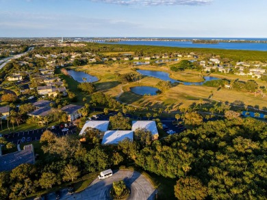 Remarkably renovated 1st floor corner unit located in Vista on Vero Beach South Golf Course in Florida - for sale on GolfHomes.com, golf home, golf lot