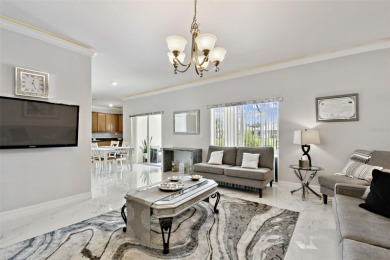 This 4 bedroom and 2.5 bath home has a great pond view, and is on Heritage Isles Golf and Country Club in Florida - for sale on GolfHomes.com, golf home, golf lot