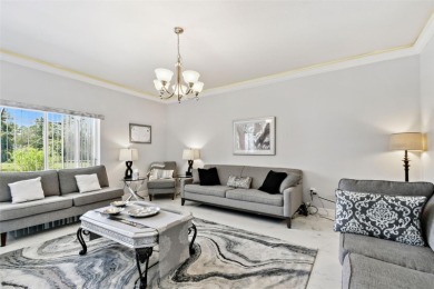 This 4 bedroom and 2.5 bath home has a great pond view, and is on Heritage Isles Golf and Country Club in Florida - for sale on GolfHomes.com, golf home, golf lot