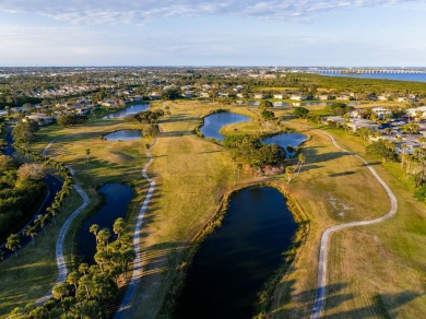 Remarkably renovated 1st floor corner unit located in Vista on Vero Beach South Golf Course in Florida - for sale on GolfHomes.com, golf home, golf lot
