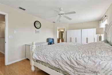 This 4 bedroom and 2.5 bath home has a great pond view, and is on Heritage Isles Golf and Country Club in Florida - for sale on GolfHomes.com, golf home, golf lot