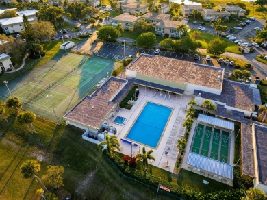 Remarkably renovated 1st floor corner unit located in Vista on Vero Beach South Golf Course in Florida - for sale on GolfHomes.com, golf home, golf lot