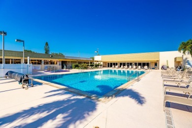 Remarkably renovated 1st floor corner unit located in Vista on Vero Beach South Golf Course in Florida - for sale on GolfHomes.com, golf home, golf lot