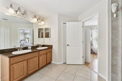 This 4 bedroom and 2.5 bath home has a great pond view, and is on Heritage Isles Golf and Country Club in Florida - for sale on GolfHomes.com, golf home, golf lot