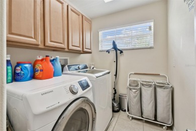 This 4 bedroom and 2.5 bath home has a great pond view, and is on Heritage Isles Golf and Country Club in Florida - for sale on GolfHomes.com, golf home, golf lot