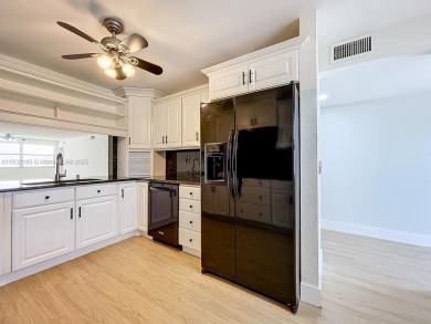 This unit is a RENOVATED & UPDATED -1370 SF 2BR/2BA unit in the on Sunrise Lakes Phase IV Golf Course in Florida - for sale on GolfHomes.com, golf home, golf lot