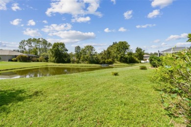 This 4 bedroom and 2.5 bath home has a great pond view, and is on Heritage Isles Golf and Country Club in Florida - for sale on GolfHomes.com, golf home, golf lot