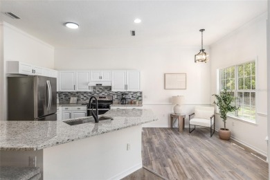 Step inside this beautifully updated 4-bedroom, 2.5-bathroom on Haile Plantation Golf and Country Club in Florida - for sale on GolfHomes.com, golf home, golf lot