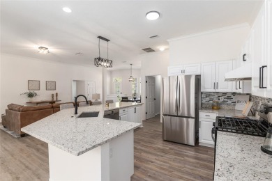 Step inside this beautifully updated 4-bedroom, 2.5-bathroom on Haile Plantation Golf and Country Club in Florida - for sale on GolfHomes.com, golf home, golf lot