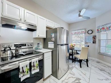 Welcome to 2948 Cottage Grove Ct -- a desirable end-unit condo on Ventura Country Club in Florida - for sale on GolfHomes.com, golf home, golf lot