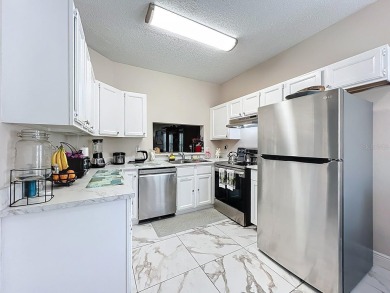 Welcome to 2948 Cottage Grove Ct -- a desirable end-unit condo on Ventura Country Club in Florida - for sale on GolfHomes.com, golf home, golf lot