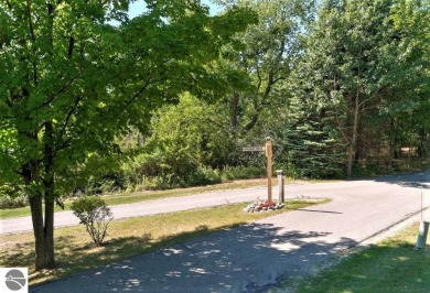 Surrounded by the lush green 3rd fairway of The Legend Golf on Shanty Creek Golf Course in Michigan - for sale on GolfHomes.com, golf home, golf lot