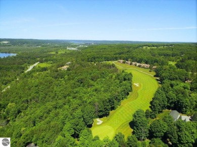 Surrounded by the lush green 3rd fairway of The Legend Golf on Shanty Creek Golf Course in Michigan - for sale on GolfHomes.com, golf home, golf lot