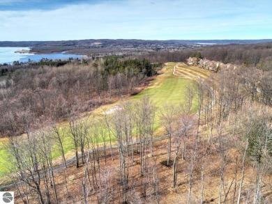 Surrounded by the lush green 3rd fairway of The Legend Golf on Shanty Creek Golf Course in Michigan - for sale on GolfHomes.com, golf home, golf lot
