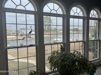 Experience resort-style living in this stunning waterfront home on Harbour Point Golf Club in North Carolina - for sale on GolfHomes.com, golf home, golf lot