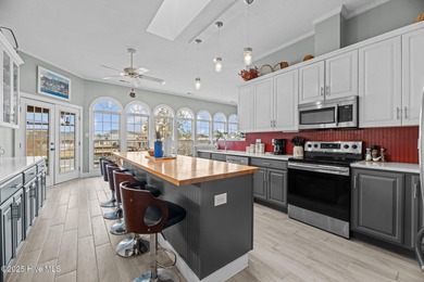 Experience resort-style living in this stunning waterfront home on Harbour Point Golf Club in North Carolina - for sale on GolfHomes.com, golf home, golf lot