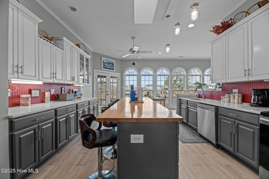 Experience resort-style living in this stunning waterfront home on Harbour Point Golf Club in North Carolina - for sale on GolfHomes.com, golf home, golf lot