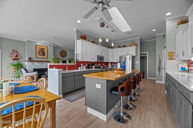 Experience resort-style living in this stunning waterfront home on Harbour Point Golf Club in North Carolina - for sale on GolfHomes.com, golf home, golf lot