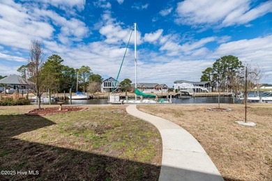 Experience resort-style living in this stunning waterfront home on Harbour Point Golf Club in North Carolina - for sale on GolfHomes.com, golf home, golf lot