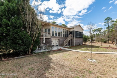 Experience resort-style living in this stunning waterfront home on Harbour Point Golf Club in North Carolina - for sale on GolfHomes.com, golf home, golf lot