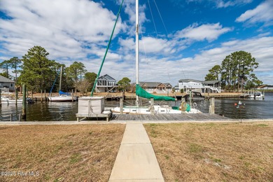 Experience resort-style living in this stunning waterfront home on Harbour Point Golf Club in North Carolina - for sale on GolfHomes.com, golf home, golf lot