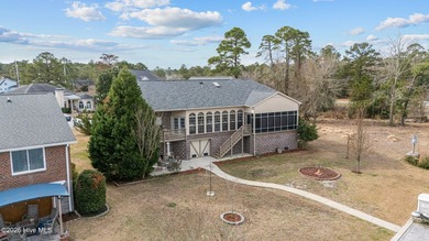 Experience resort-style living in this stunning waterfront home on Harbour Point Golf Club in North Carolina - for sale on GolfHomes.com, golf home, golf lot