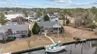 Experience resort-style living in this stunning waterfront home on Harbour Point Golf Club in North Carolina - for sale on GolfHomes.com, golf home, golf lot