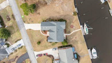 Experience resort-style living in this stunning waterfront home on Harbour Point Golf Club in North Carolina - for sale on GolfHomes.com, golf home, golf lot