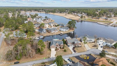 Experience resort-style living in this stunning waterfront home on Harbour Point Golf Club in North Carolina - for sale on GolfHomes.com, golf home, golf lot